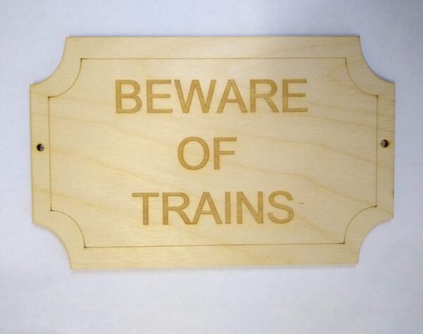 Wooden sign Beware of trains